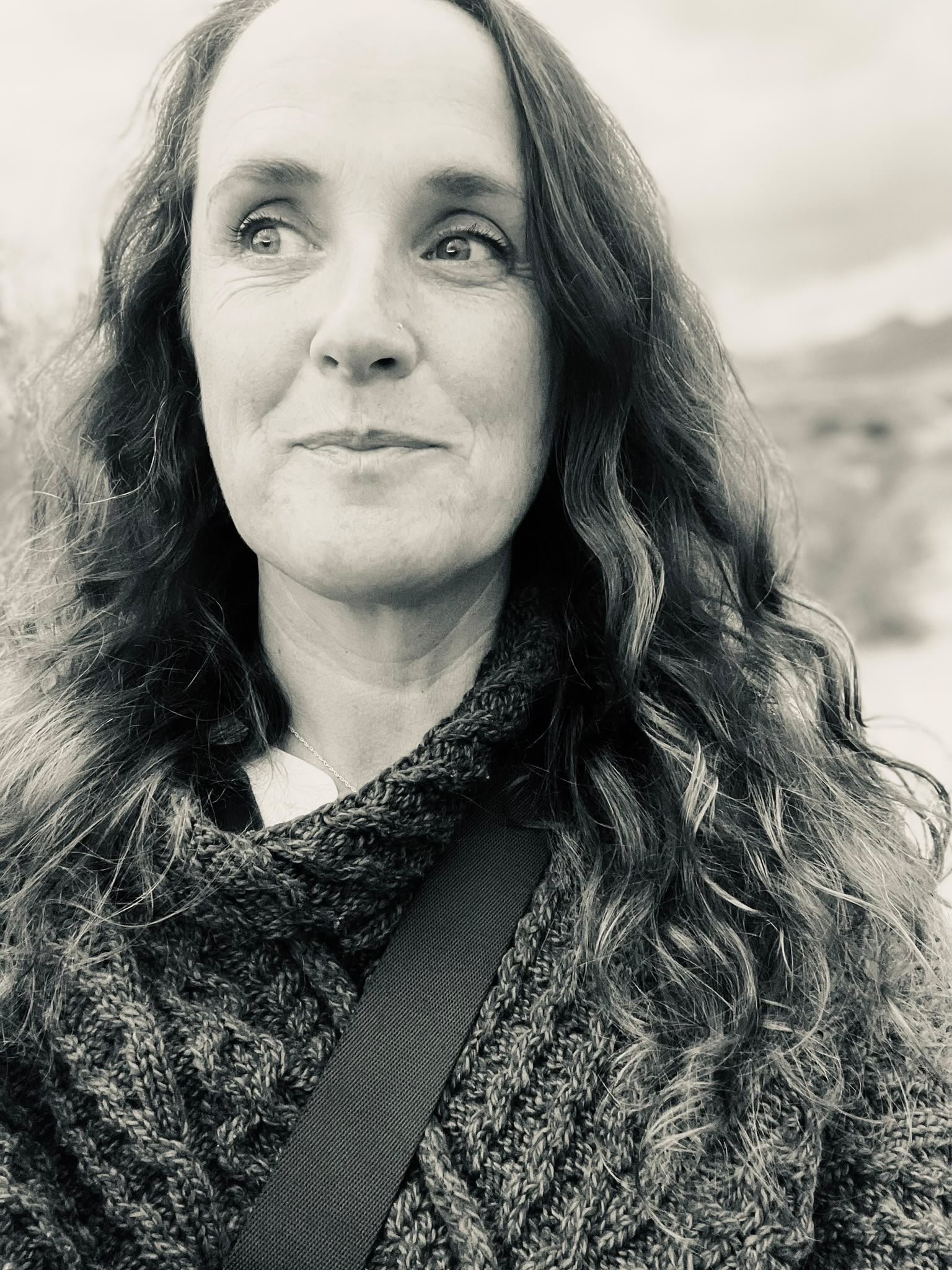 Yvonne Skelly outdoors in a reflective moment